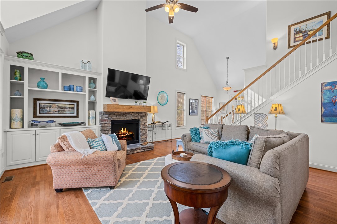 7 Divots Landing Salem, SC 29676 - Photo 11 of 47 This bright living area features soaring ceilings and an inviting fireplace, perfect for gatherings.