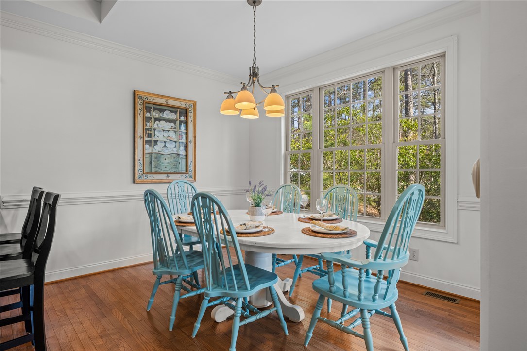 7 Divots Landing Salem, SC 29676 - Photo 13 of 47 This bright dining room features rich hardwood flooring and large windows, perfect for memorable gatherings.
