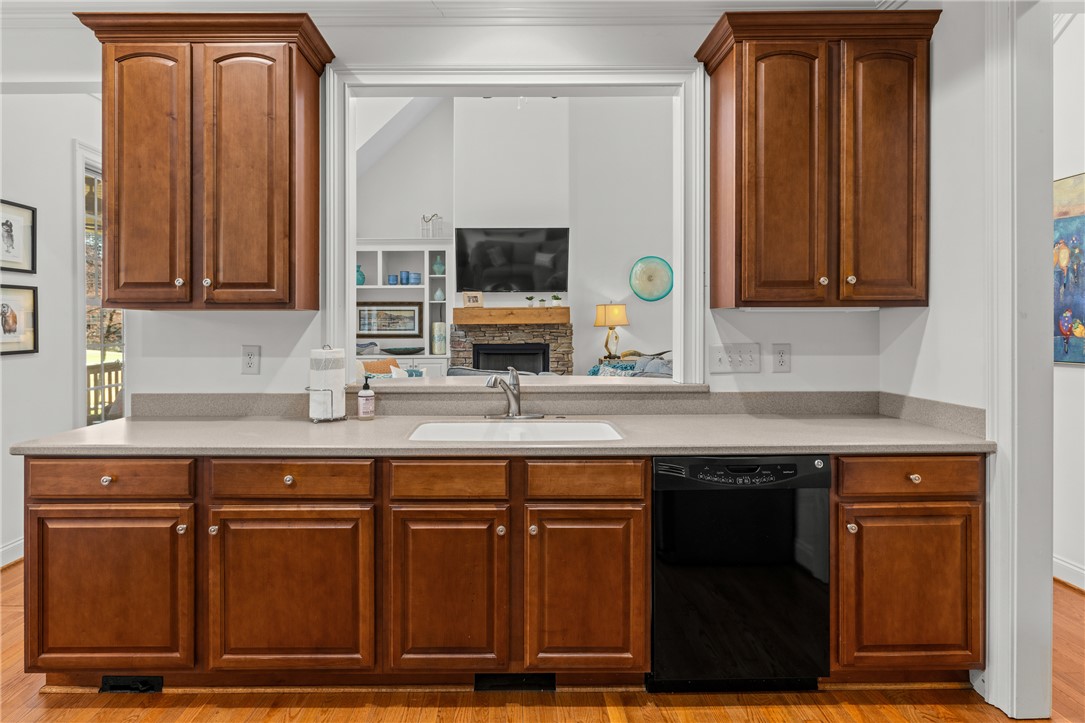 7 Divots Landing Salem, SC 29676 - Photo 18 of 47 This kitchen boasts beautiful wood cabinetry, sleek countertops, and a seamless connection to the living area.