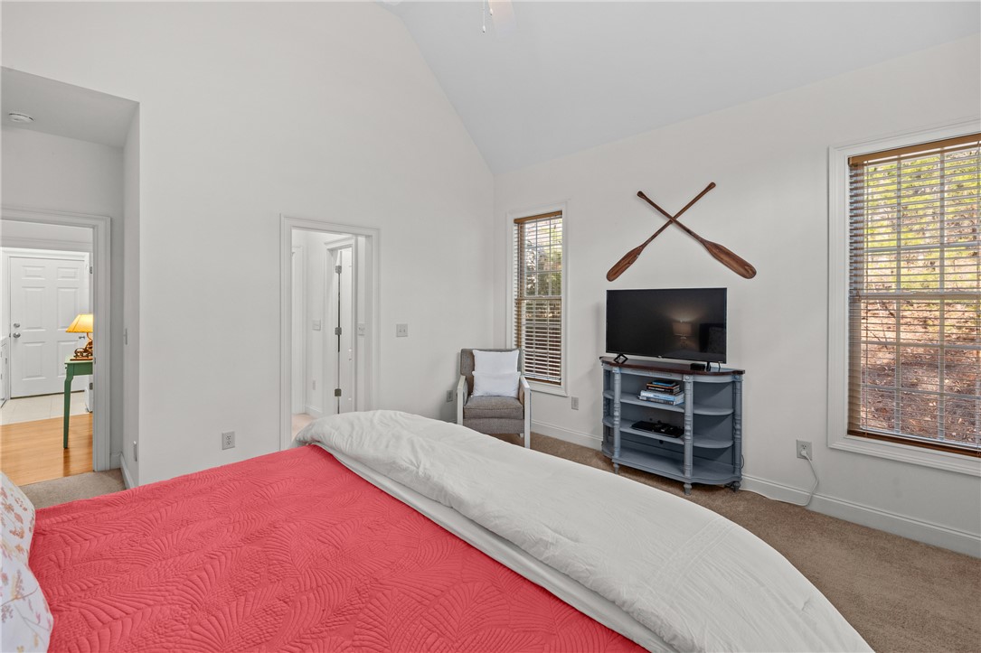 7 Divots Landing Salem, SC 29676 - Photo 21 of 47 This spacious bedroom offers high vaulted ceilings and natural light from multiple windows.
