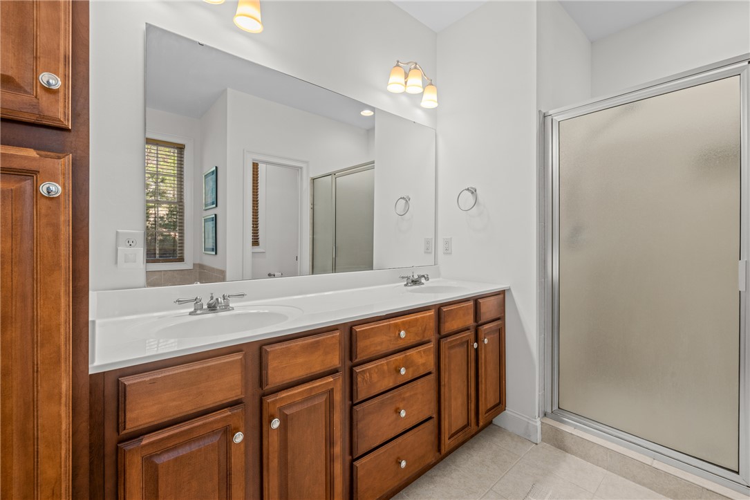 7 Divots Landing Salem, SC 29676 - Photo 24 of 47 This bathroom features dual sinks and a sleek shower, offering both style and function.