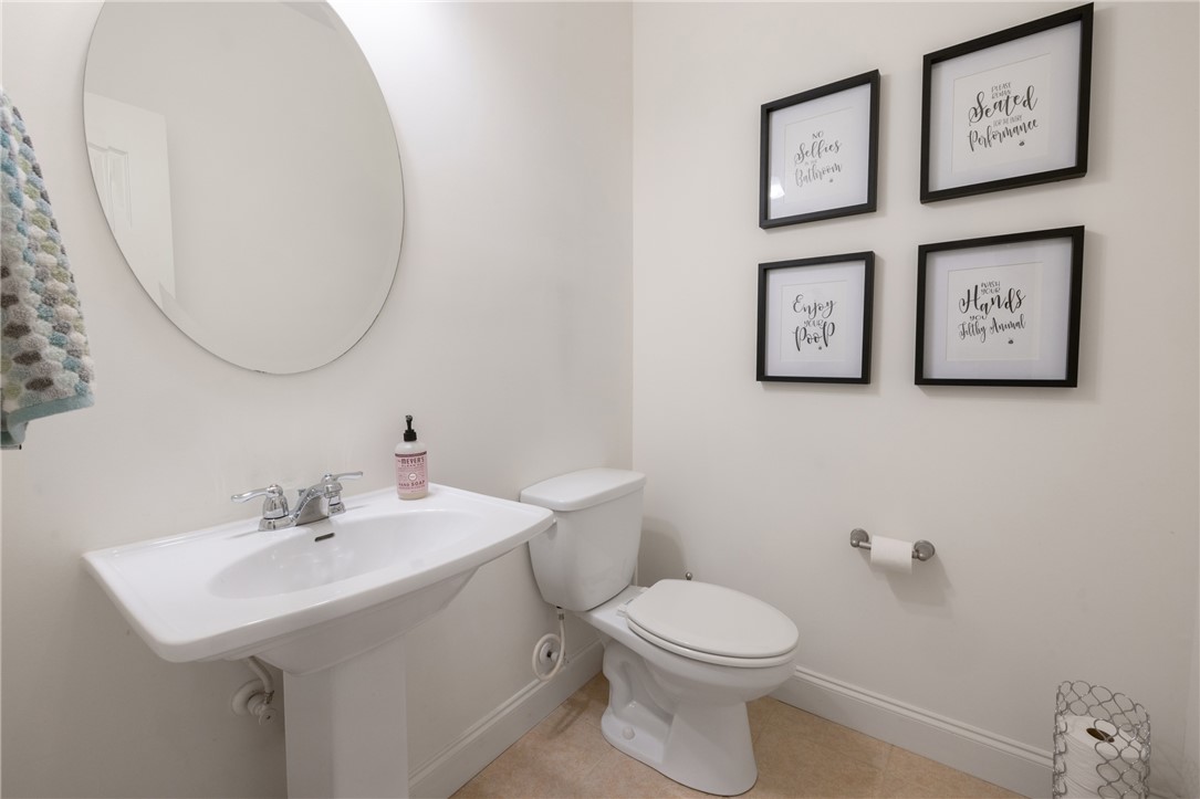 7 Divots Landing Salem, SC 29676 - Photo 28 of 47 This clean and bright powder room features a classic pedestal sink and toilet, offering convenience and style.
