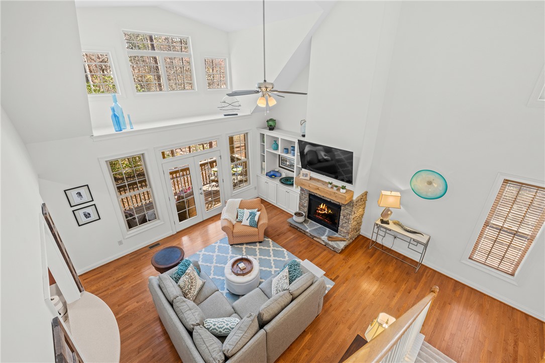 7 Divots Landing Salem, SC 29676 - Photo 30 of 47 This airy living space features soaring ceilings, a cozy fireplace, and abundant natural light.