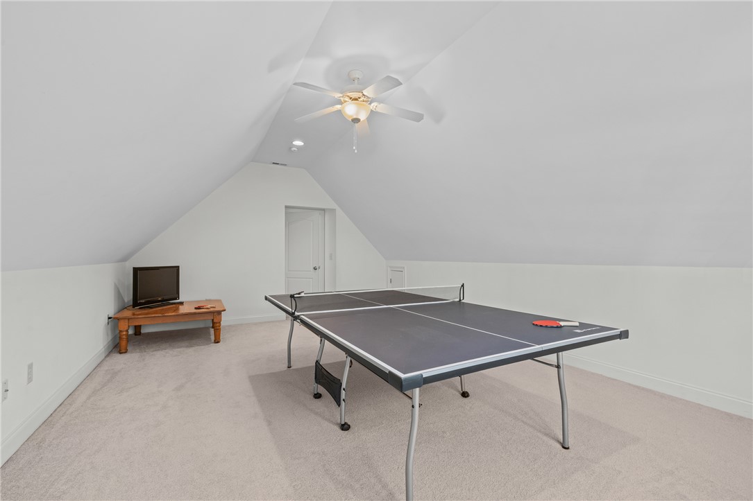 7 Divots Landing Salem, SC 29676 - Photo 35 of 47 This versatile recreation room features a sloped ceiling and soft carpet flooring.