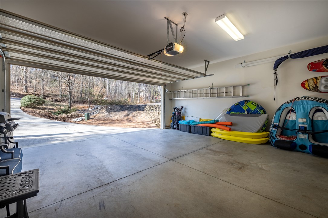 7 Divots Landing Salem, SC 29676 - Photo 36 of 47 This spacious garage offers ample room for parking and additional storage solutions.