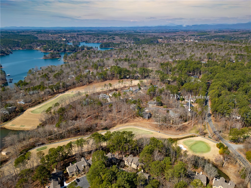 7 Divots Landing Salem, SC 29676 - Photo 39 of 47 This elevated perspective captures a serene residential landscape nestled between a shimmering lake and verdant golf course.