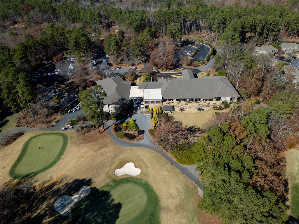 7 Divots Landing Salem, SC 29676 - Photo 46 of 47 This aerial view showcases a golf course and clubhouse nestled within a lush, wooded landscape.