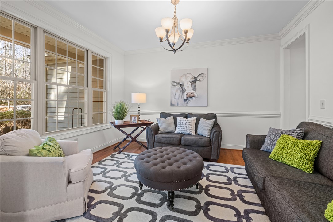 7 Divots Landing Salem, SC 29676 - Photo 6 of 47 This bright living space features classic hardwood floors and an elegant chandelier, perfect for comfortable gatherings.