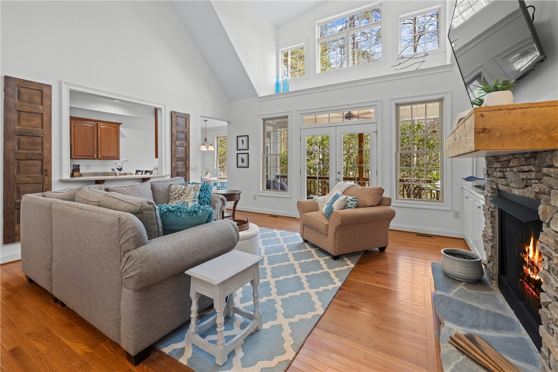 7 Divots Landing Salem, SC 29676 - Photo 9 of 47 This living room features vaulted ceilings, abundant natural light, and a cozy fireplace.