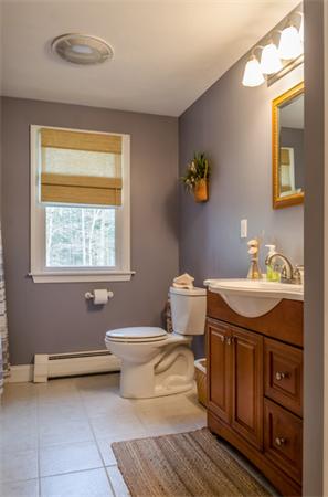 38 Earls Court Rochester, MA 02770 - Photo 16 of 26 a bathroom with a granite countertop toilet sink and mirror