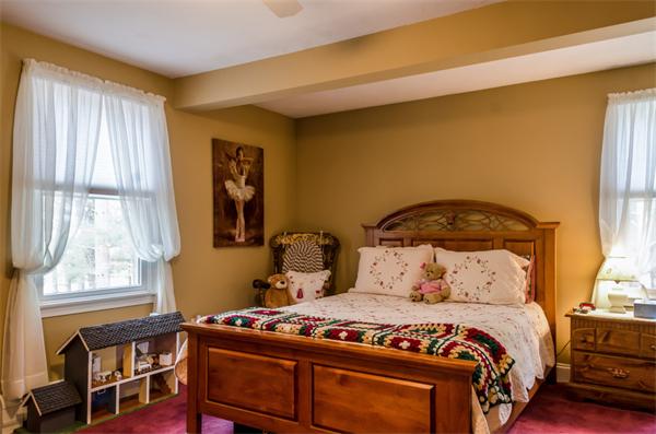 38 Earls Court Rochester, MA 02770 - Photo 19 of 26 a bedroom with a bed and wooden floor