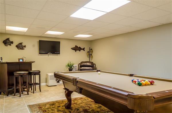 38 Earls Court Rochester, MA 02770 - Photo 22 of 26 a room with furniture and flat screen tv