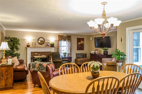 38 Earls Court Rochester, MA 02770 - Photo 4 of 26 a view of a dining room with furniture a chandelier and wooden floor