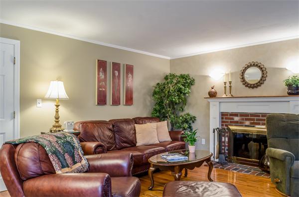 38 Earls Court Rochester, MA 02770 - Photo 6 of 26 a living room with furniture and a fireplace