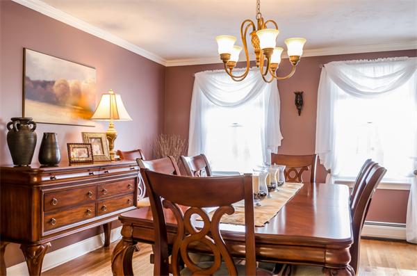 38 Earls Court Rochester, MA 02770 - Photo 9 of 26 a view of a dining room with furniture and a chandelier