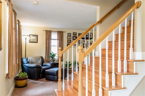 38 Earls Court Rochester, MA 02770 - Photo 10 of 26 a living room with furniture and a potted plant
