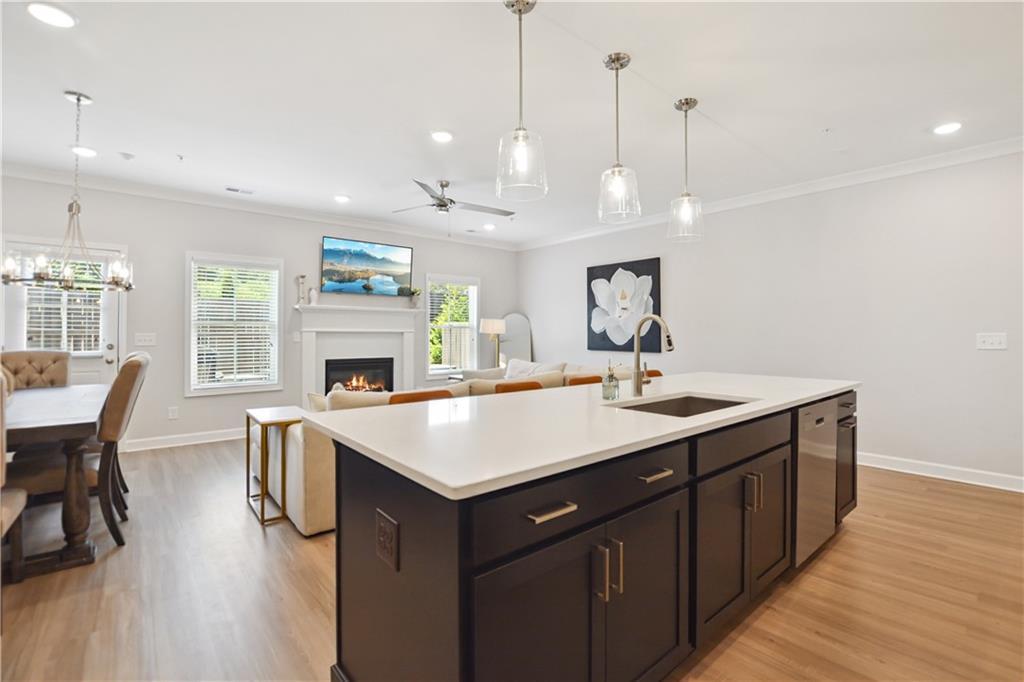 765 Trevett Way Marietta, GA 30066 - Photo 10 of 44 a kitchen with a sink a counter space and a dining table