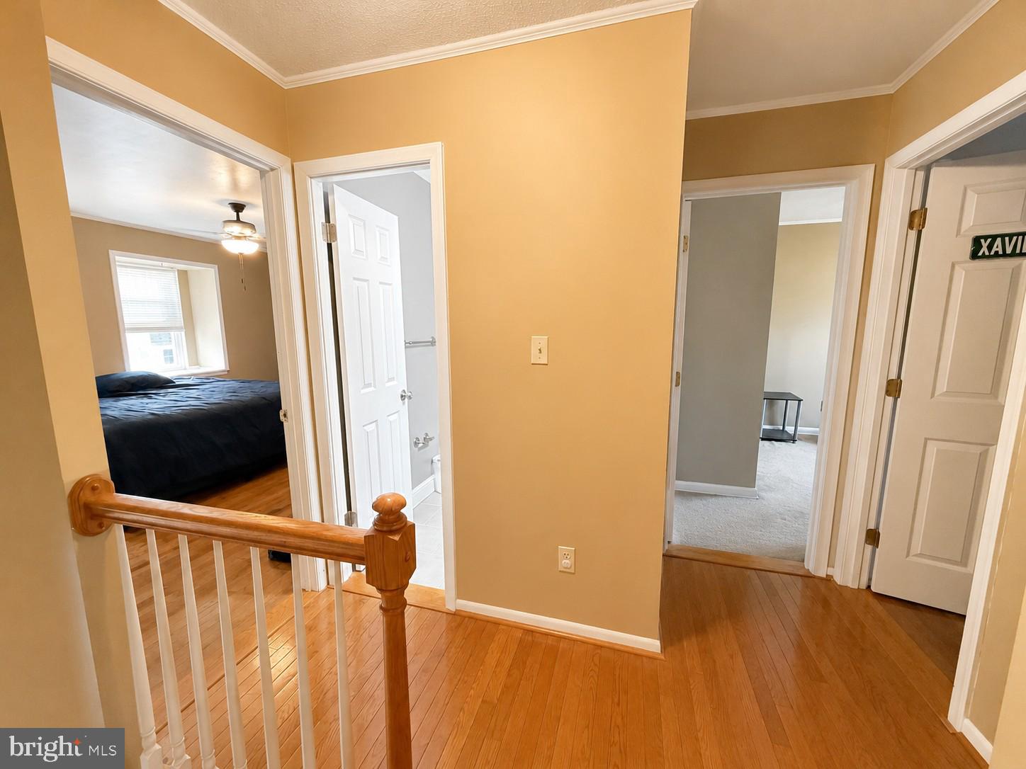 813 Thimbleberry Road, Unit 813 Baltimore, MD 21220 - Photo 12 of 32 Inviting hallway with warm tones.
