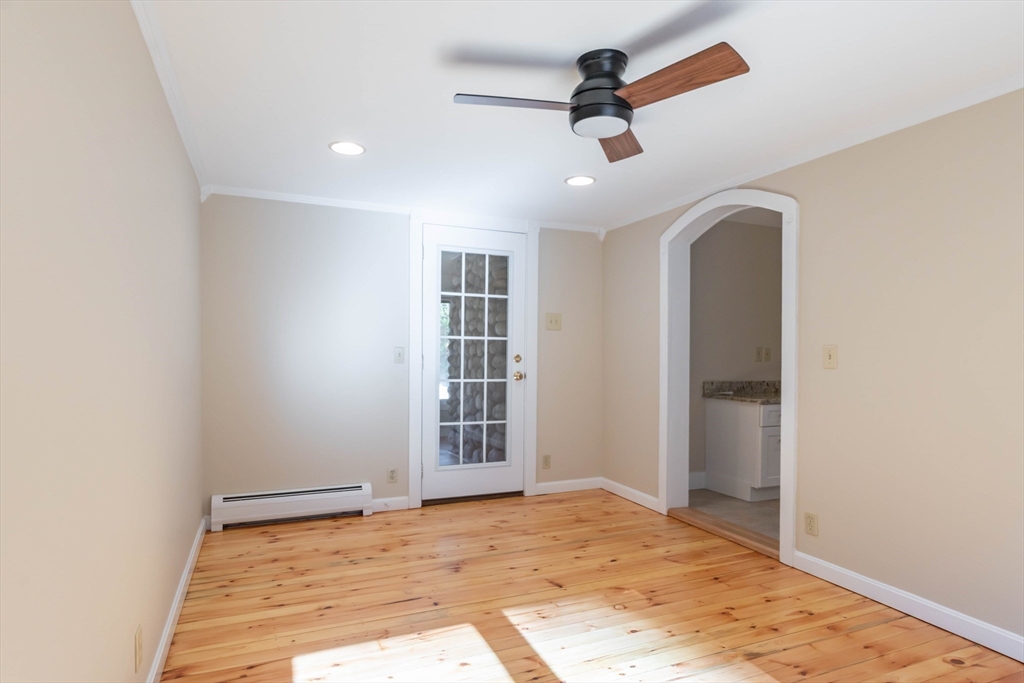 137 Lowell Road Pepperell, MA 01463 - Photo 15 of 40 an empty room with closet and wooden floor