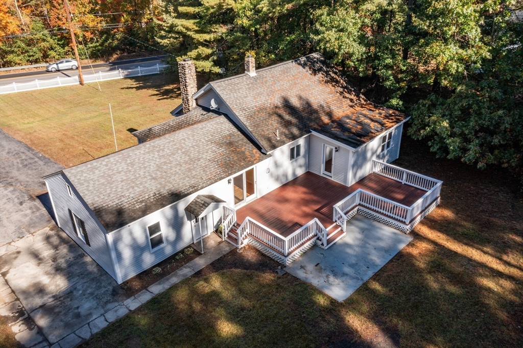 137 Lowell Road Pepperell, MA 01463 - Photo 31 of 40 an aerial view of a house with roof deck