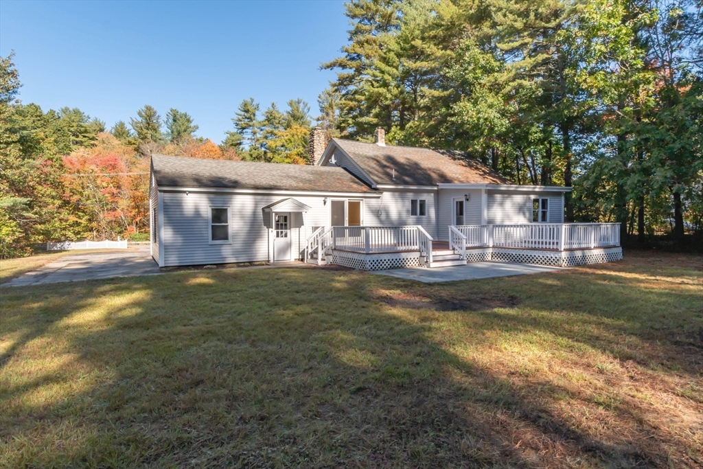 137 Lowell Road Pepperell, MA 01463 - Photo 32 of 40 a front view of a house with garden