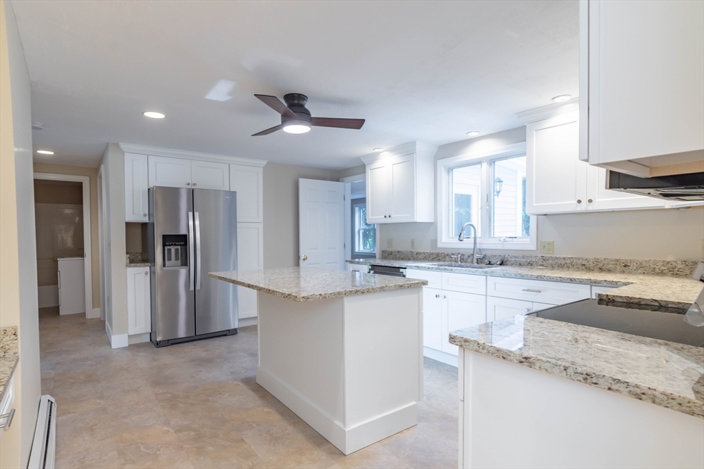 137 Lowell Road Pepperell, MA 01463 - Photo 7 of 40 a kitchen with stainless steel appliances granite countertop a refrigerator and a sink