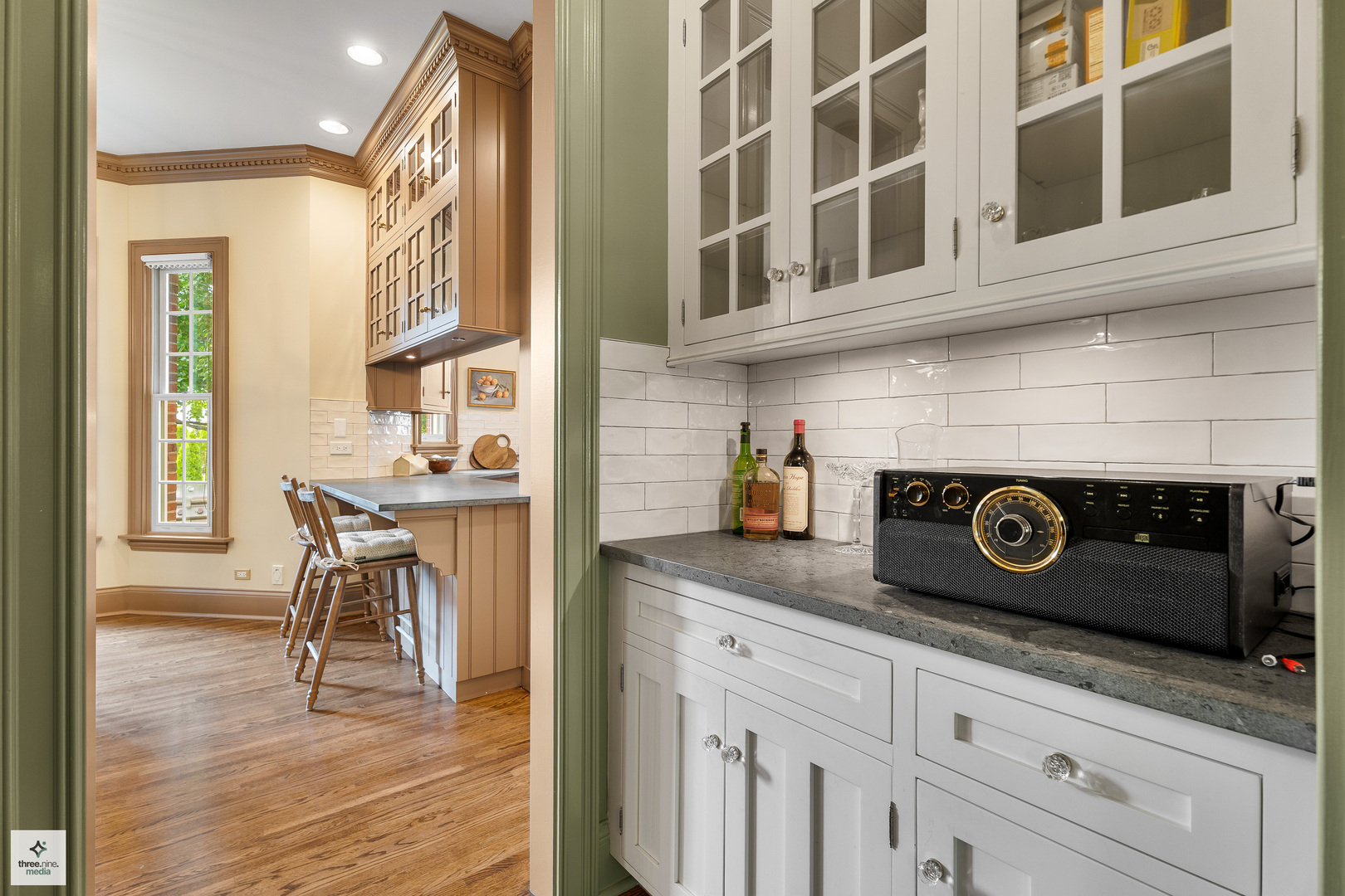 8010 Greenbriar Court Burr Ridge, IL 60527 - Photo 15 of 52 a kitchen with a stove and a microwave