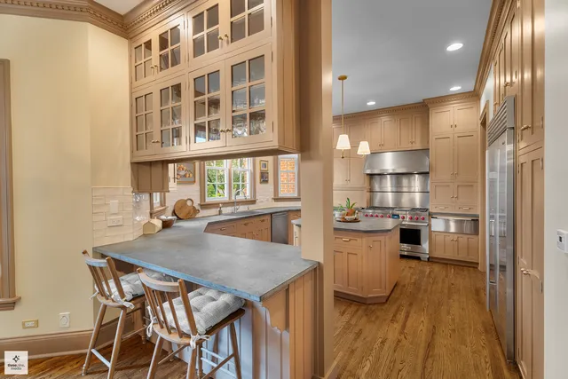 a kitchen with a sink window and cabinets