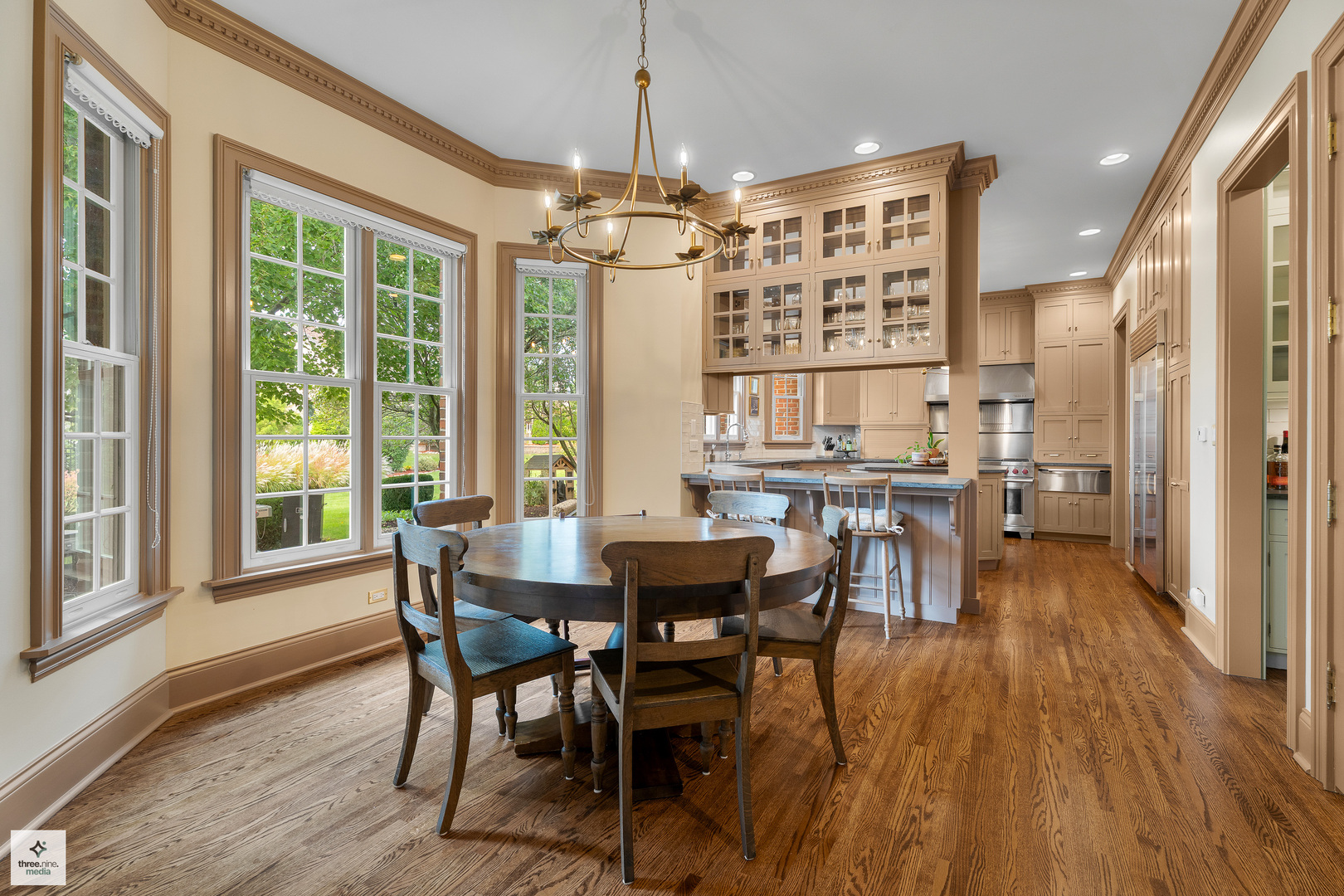 8010 Greenbriar Court Burr Ridge, IL 60527 - Photo 22 of 52 a view of a dining room with furniture window and wooden floor