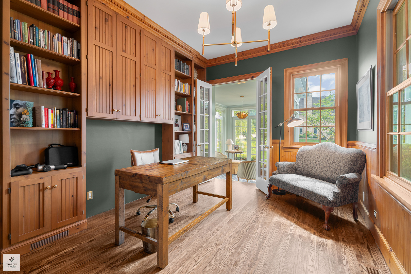 8010 Greenbriar Court Burr Ridge, IL 60527 - Photo 28 of 52 a living room with furniture and a book shelf