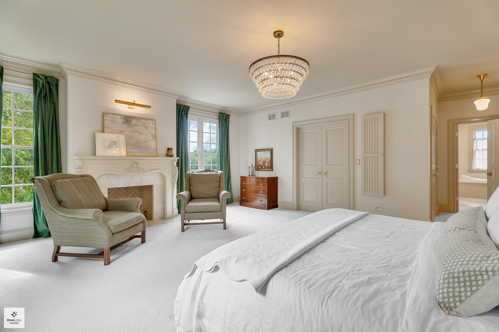 8010 Greenbriar Court Burr Ridge, IL 60527 - Photo 32 of 52 a spacious bedroom with a bed couch and windows