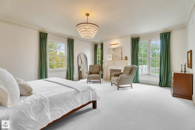 a spacious bathroom with a double vanity sink a bathtub a mirror a vanity and a shower