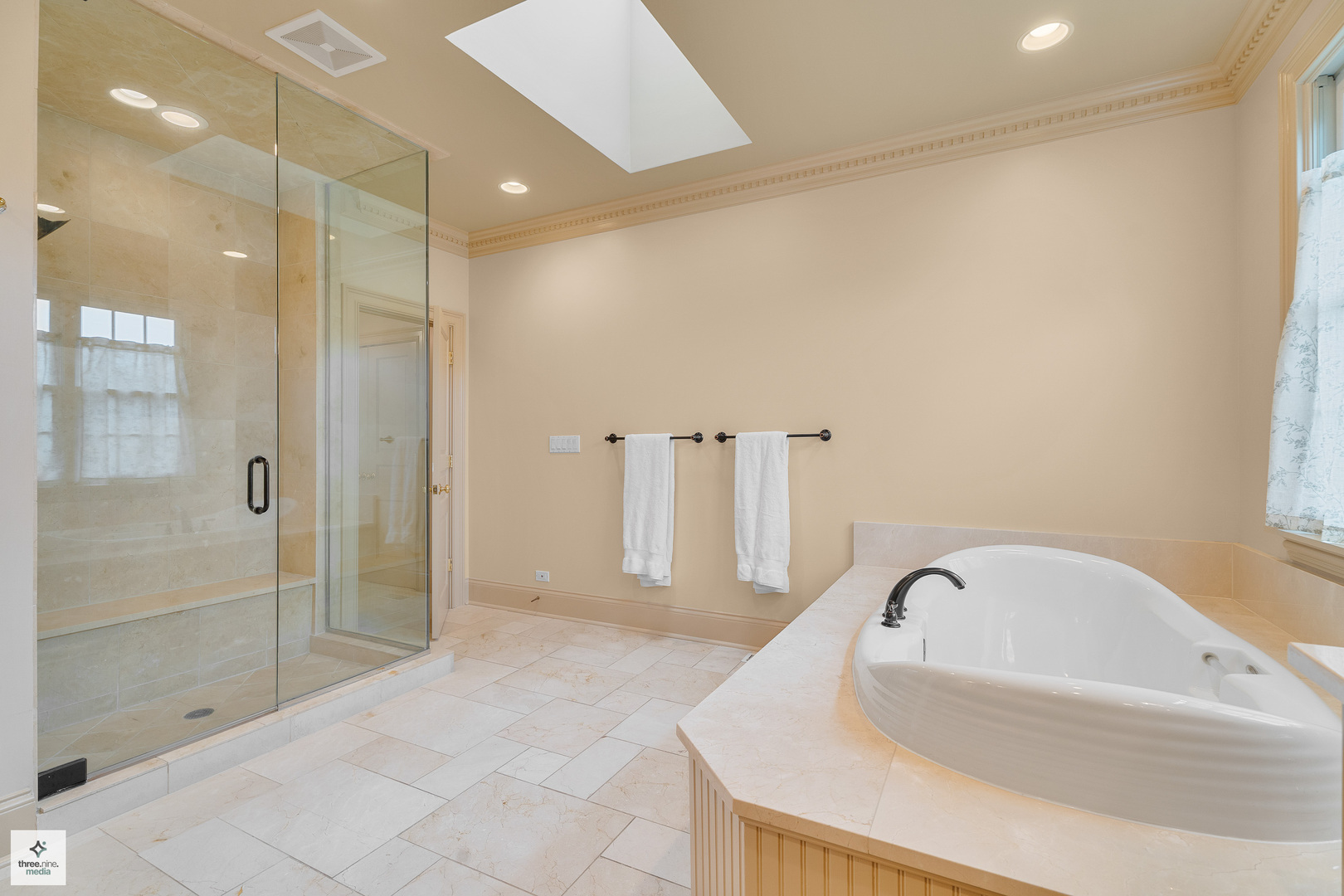 8010 Greenbriar Court Burr Ridge, IL 60527 - Photo 34 of 52 a bathroom with a bathtub and shower