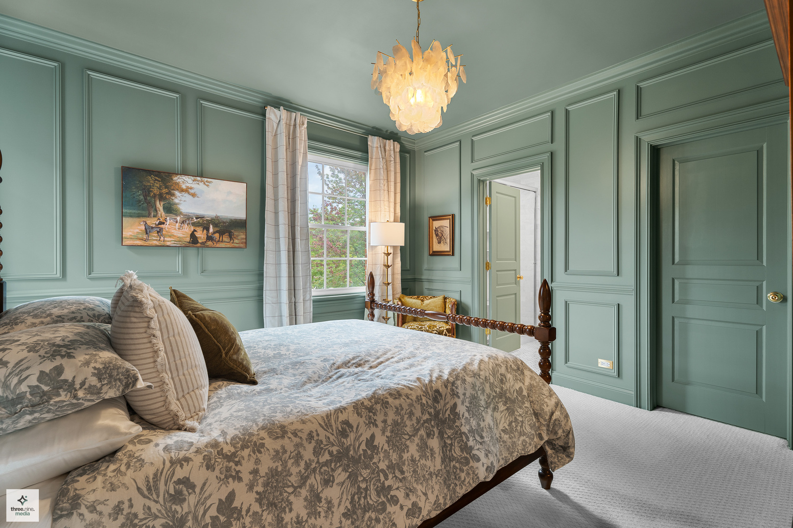 8010 Greenbriar Court Burr Ridge, IL 60527 - Photo 36 of 52 a bedroom with a large bed and a chandelier