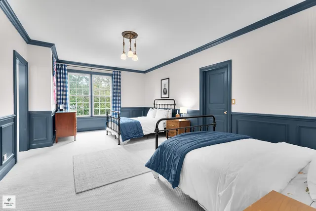 a bedroom with a bed and dresser