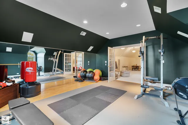 a room with furniture and view of kitchen