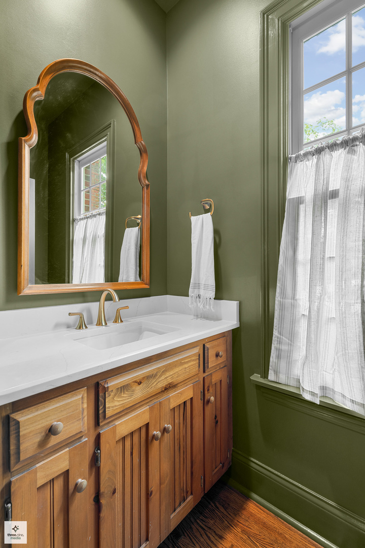 8010 Greenbriar Court Burr Ridge, IL 60527 - Photo 52 of 52 a bathroom with a granite countertop sink and a mirror