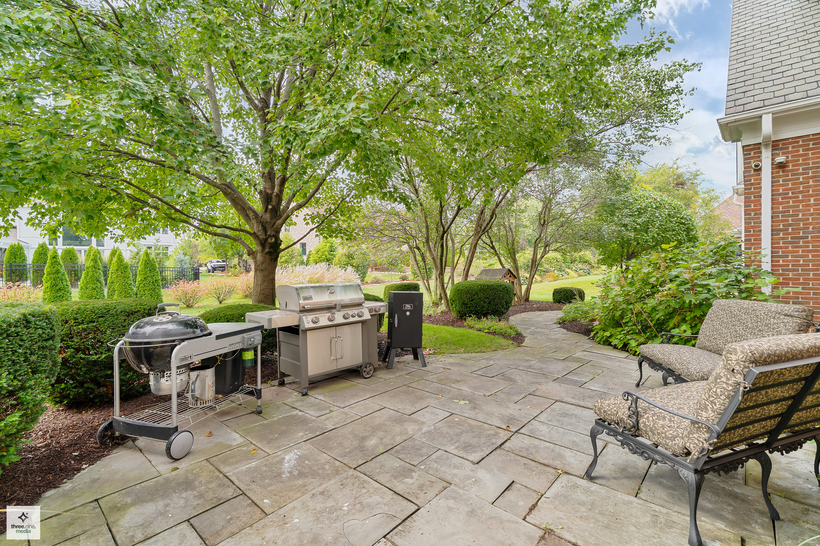 8010 Greenbriar Court Burr Ridge, IL 60527 - Photo 6 of 52 a view of a patio with a dining table and chairs with a large tree