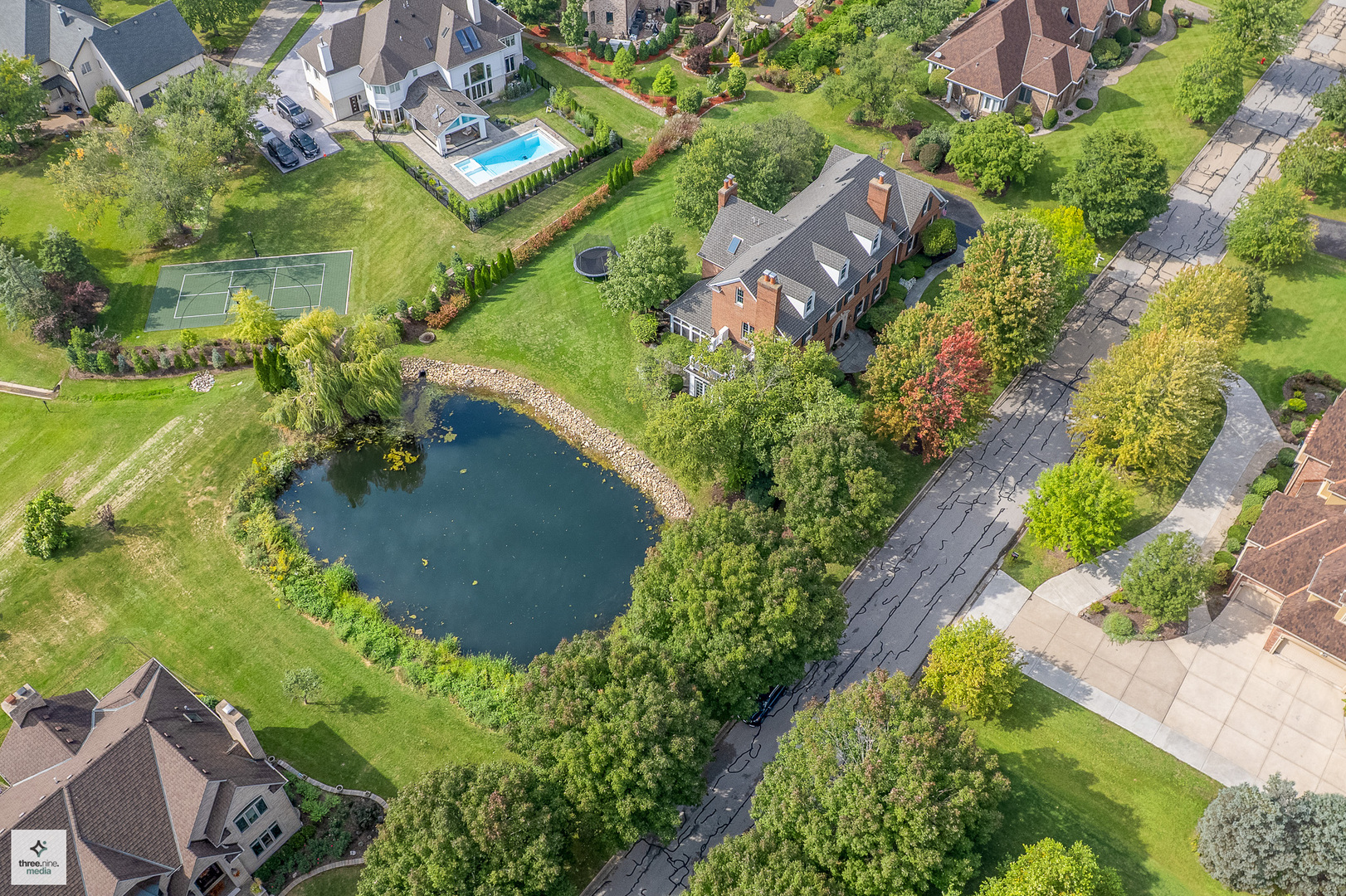 8010 Greenbriar Court Burr Ridge, IL 60527 - Photo 8 of 52 an aerial view of residential house with outdoor space and swimming pool