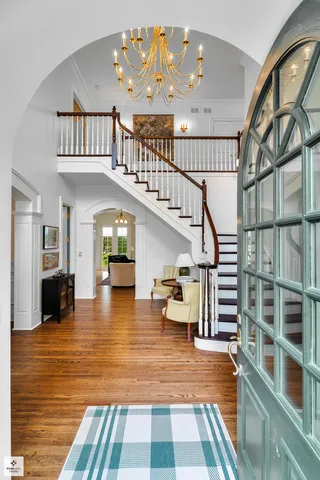 a view of entryway livingroom and hallway with wooden floor