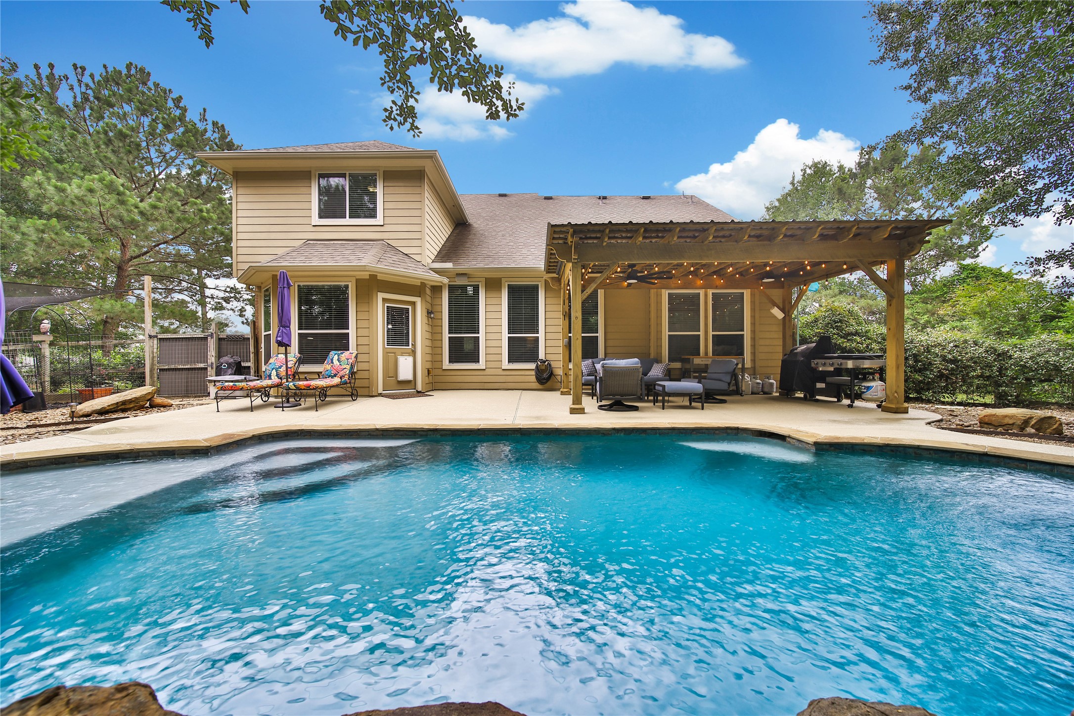 9223 Wapiti Trail Conroe, TX 77303 - Photo 40 of 45 a view of a patio with swimming pool table and chairs