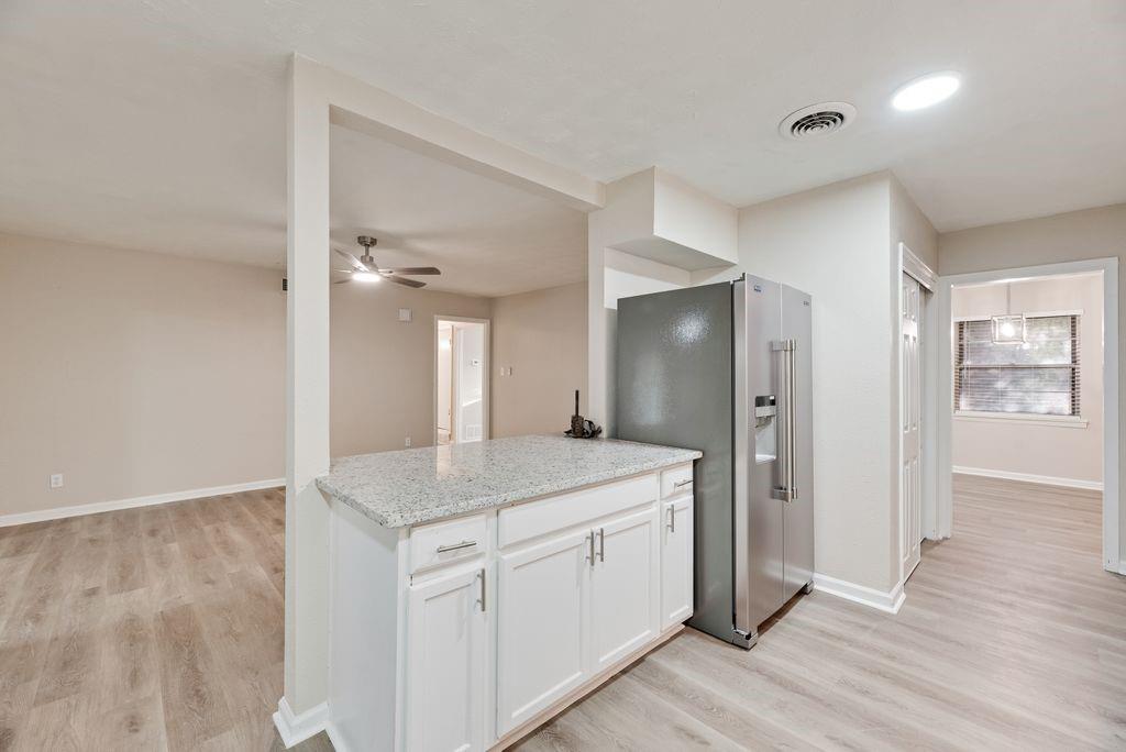 5706 Rocky Ridge Road Dallas, TX 75241 - Photo 6 of 31 a bathroom with a granite countertop sink mirror and toilet