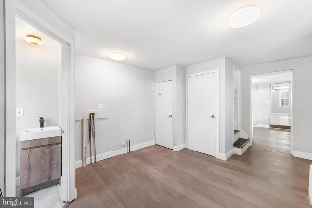 a bathroom with a toilet a sink and a window