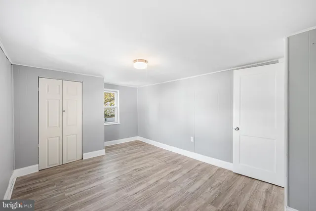 a bathroom with a toilet and a bathtub