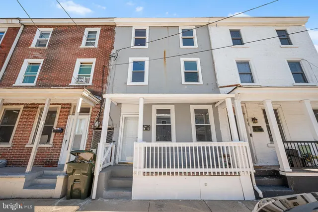 a view of a brick building with many windows