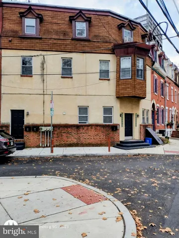 a view of a building with a street