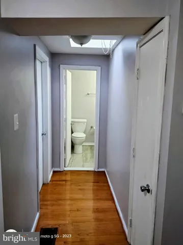 a room with cabinets and wooden floor