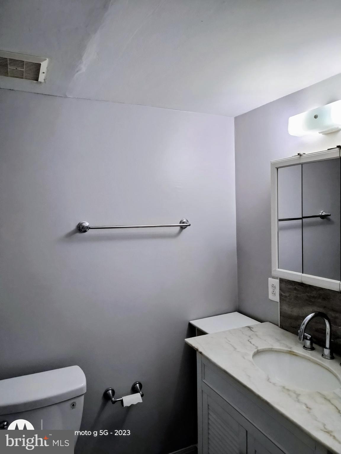 2437 Grays Ferry Avenue, Unit 3 Philadelphia, PA 19146 - Photo 12 of 15 a bathroom with a sink toilet and vanity