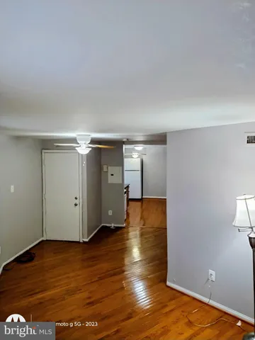 a view of a room with wooden floor