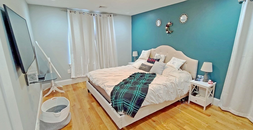 6 Sylvan Road Holbrook, MA 02343 - Photo 11 of 24 a bedroom with a bed and a mirror